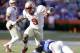 Florida State running back Karlos Williams (9) runs past Florida defensive lineman Damien Jacobs, lower right, for yardage during the second half of an NCAA college football game in Gainesville, Fla., Saturday, Nov. 30, 2013. Florida State defeated Florida 37-7.(AP Photo/John Raoux)