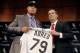 Cuban slugger Jose Abreu, left, smiles with Chicago White Sox General Manager Rick Hahn during a news conference where Hahn announced a six-year, $68 million deal with Abreu Tuesday, Oct. 29, 2013, in Chicago. The 26-year-old Abreu will receive a signing bonus of $10 million and earn $7 million in 2014. (AP Photo/Charles Rex Arbogast)