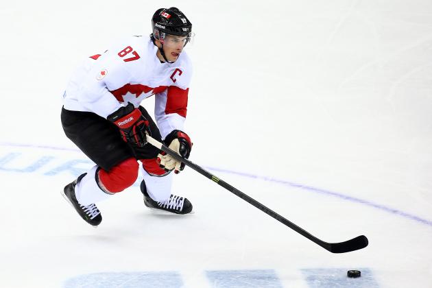 SOCHI, RUSSIA - FEBRUARY 19:  Sidney Crosby #87 of Canada controls the puck against Latvia during the Men's Ice Hockey Quarterfinal Playoff on Day 12 of the 2014 Sochi Winter Olympics at Bolshoy Ice Dome on February 19, 2014 in Sochi, Russia.  (Photo by Streeter Lecka/Getty Images)