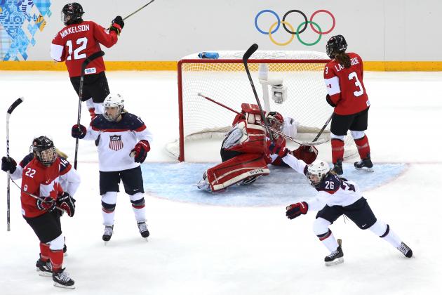 SOCHI, RUSSIA - FEBRUARY 12: Kendall Coyne #26 of the United States celebrates as Charline Labonte #32 of Canada allows a goal by Anne Schleper #15 in the third period during the Women's Ice Hockey Preliminary Round Group A game on day five of the Sochi 2014 Winter Olympics at Shayba Arena on February 12, 2014 in Sochi, Russia. (Photo by Bruce Bennett/Getty Images)