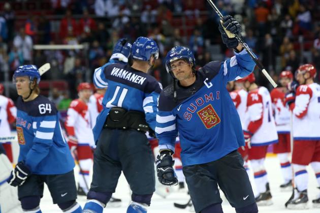 SOCHI, RUSSIA - FEBRUARY 19:  Mikael Granlund #64, Ossi Vaananen #4 and Teemu Selanne #8 of Finland celebrate after defeating Russia 3-1 during the Men's Ice Hockey Quarterfinal Playoff on Day 12 of the 2014 Sochi Winter Olympics at Bolshoy Ice Dome on February 19, 2014 in Sochi, Russia.  (Photo by Bruce Bennett/Getty Images)