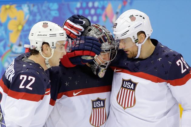 USA defenseman Kevin Shattenkirk, goaltender Jonathan Quick and forward Blake Wheeler celebrate their 5-2 win over the Czech Republic after the men's quarterfinal hockey game in Shayba Arena at the 2014 Winter Olympics, Wednesday, Feb. 19, 2014, in Sochi, Russia. (AP Photo/David J. Phillip )