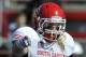South Dakota's Tyler Starr (11), yells to teammates during the first half of an NCAA football game against Illinois State in Normal, Ill., Saturday, Oct. 26, 2013. (AP Photo/Paul Beaty)