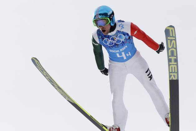 Italy's Alessandro Pittin makes an attempt during the ski jumping portion of the Nordic combined Gundersen large hill team competition at the 2014 Winter Olympics, Thursday, Feb. 20, 2014, in Krasnaya Polyana, Russia. (AP Photo/Dmitry Lovetsky)