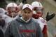 Nebraska head coach Bo Pelini leads his team onto the field a Beaver Stadium before an NCAA college football game against Penn State in State College, Pa., Saturday, Nov. 23, 2013. (AP Photo/Gene J. Puskar)