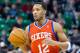 Feb 12, 2014; Salt Lake City, UT, USA; Philadelphia 76ers small forward Evan Turner (12) dribbles up the court during the first quarter against the Utah Jazz at EnergySolutions Arena. Mandatory Credit: Russ Isabella-USA TODAY Sports