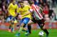 SUNDERLAND, ENGLAND - SEPTEMBER 14: Mesut Oezil of Arsenal takes on Valentin Roberge of Sunderland during the Barclays Premier League match between Sunderland and Arsenal at the Stadium of Light on September 14, 2013 in Sunderland, England. (Photo by Laurence Griffiths/Getty Images)
