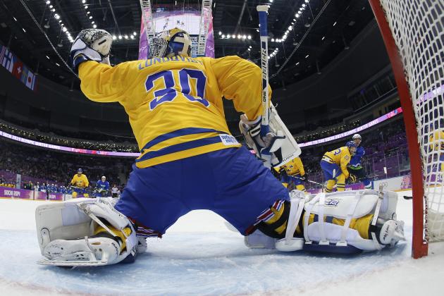 Sweden goaltender Henrik Lundqvist blocks a shot by Slovenia in the first period of a men's ice hockey game at the 2014 Winter Olympics, Wednesday, Feb. 19, 2014, in Sochi, Russia. (AP Photo/Julio Cortez, Pool)
