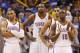 Oklahoma City Thunder guard Russell Westbrook (0), forward Kevin Durant (35), guard Thabo Sefolosha (25) and guard Reggie Jackson (15) wait for an offical's ruling in the fourth quarter of an NBA basketball game against the Orlando Magic in Oklahoma City, Sunday, Dec. 15, 2013. Oklahoma City won 101-98. (AP Photo/Sue Ogrocki)