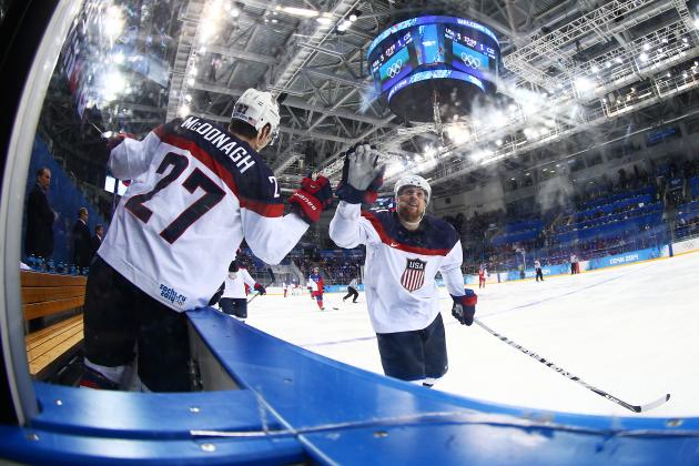 SOCHI, RUSSIA - FEBRUARY 19: Phil Kessel #81 of the United States celebrates with teammate Ryan McDonagh #27 of the United States after scoring his team's fifth goal against the Czech Republic 53 in the third period during the Men's Ice Hockey Quarterfinal Playoff on Day 12 of the 2014 Sochi Winter Olympics at Shayba Arena on February 19, 2014 in Sochi, Russia. (Photo by Clive Mason/Getty Images)