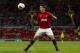 Manchester United's Adnan Januzaj controls the ball during his team's testimonial soccer match for Rio Ferdinand against Sevilla at Old Trafford Stadium, Manchester, England, Friday Aug. 9, 2013. (AP Photo/Jon Super)