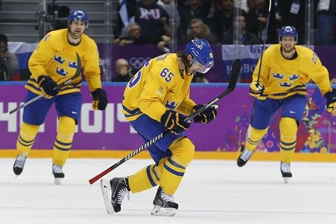 Sweden defenseman Erik Karlsson reacts after scoring a goal against Finland during the second period of a men's semifinal ice hockey game at the 2014 Winter Olympics, Friday, Feb. 21, 2014, in Sochi, Russia. (AP Photo/Petr David Josek)