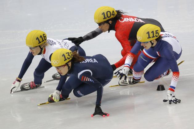 From left, Elise Christie of Britain, Park Seung-hi of South Korea, Marie-Eve Drolet of Canada and Veronique Pierron of France compete in a women's 1000m short track speedskating quarterfinal at the Iceberg Skating Palace during the 2014 Winter Olympics, Friday, Feb. 21, 2014, in Sochi, Russia. (AP Photo/Vadim Ghirda)