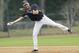 New York Yankees shortstop Derek Jeter throws to second base during spring training baseball practice Friday, Feb. 21, 2014, in Tampa, Fla. (AP Photo/Charlie Neibergall)