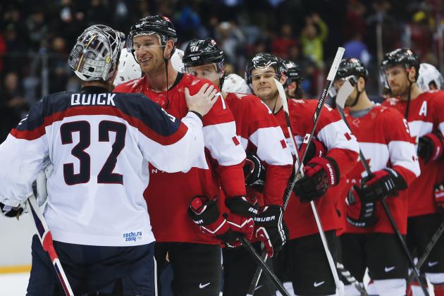 USA goaltender Jonathan Quick greets Canada forward Jeff Carter after Canada beat the USA 1-0 in a men's semifinal ice hockey game at the 2014 Winter Olympics, Friday, Feb. 21, 2014, in Sochi, Russia. (AP Photo/Petr David Josek)