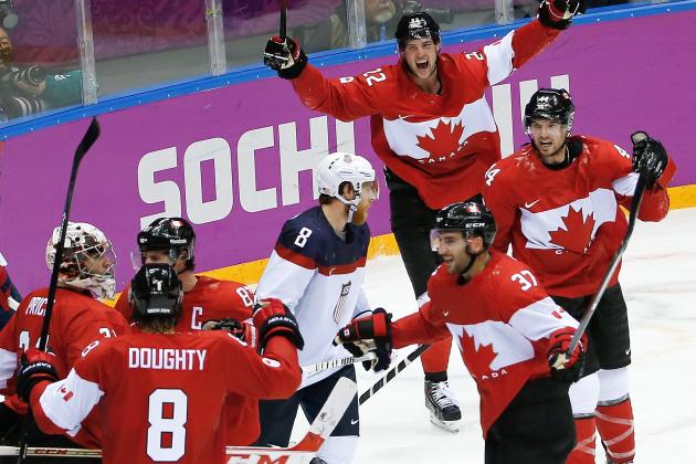 Canada celebrates their 1-0 victory over Team USA in the men's semifinal ice hockey game at the 2014 Winter Olympics, Friday, Feb. 21, 2014, in Sochi, Russia. (AP Photo/Matt Slocum)