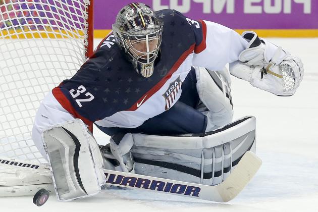 USA goaltender Jonathan Quick pushes off the puck to a teammate during the second period of a men's semifinal ice hockey game against Canada at the 2014 Winter Olympics, Friday, Feb. 21, 2014, in Sochi, Russia. (AP Photo/Julio Cortez)