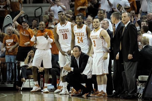 AUSTIN, TX - FEBRUARY 01:  Members of the Texas Longhorns react to a score against the Kansas Jayhawks during a game at The Frank Erwin Center on February 1, 2014 in Austin, Texas.  (Photo by Stacy Revere/Getty Images)