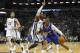 Los Angeles Clippers guard Chris Paul (3) goes to the basket against Memphis Grizzlies guard Mike Conley (11) and center Marc Gasol (33), of Spain, in the first half of an NBA basketball game Friday, Feb. 21, 2014, in Memphis, Tenn. (AP Photo/Lance Murphey)