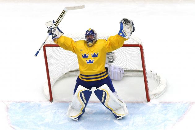 SOCHI, RUSSIA - FEBRUARY 21:  Henrik Lundqvist #30 of Sweden celebrates after defeating Finland 2-1 during the Men's Ice Hockey Semifinal Playoff on Day 14 of the 2014 Sochi Winter Olympics at Bolshoy Ice Dome on February 21, 2014 in Sochi, Russia.  (Photo by Martin Rose/Getty Images)