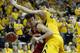 Wisconsin forward Frank Kaminsky tries to go around Iowa center Adam Woodbury during the first half of an NCAA college basketball game in Iowa City, Iowa, Saturday, Feb. 22, 2014. (AP Photo/Justin Hayworth)