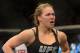 Dec 28, 2013; Las Vegas, NV, USA; Ronda Rousey in the cage after defeating Miesha Tate (not pictured) in their UFC Women's Bantamweight Championship Bout at the MGM Grand Garden Arena. Rousey won with an arm bar in the third round. Mandatory Credit: Jayne Kamin-Oncea-USA TODAY Sports