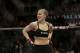 Ronda Rousey reacts after defeating Sara McMann following a UFC 170 mixed martial arts women's bantamweight title bout on Saturday, Feb. 22, 2014, in Las Vegas. (AP Photo/Isaac Brekken)