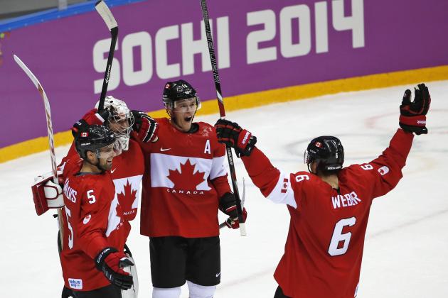 Dan Hamhuis of Canada (5), goalkeeper Carey Price of Canada (31), Jonathan Toews of Canada (16) and Shea Weber of Canada (6) celebrate their 3-0 win over Sweden in the men's gold medal ice hockey game at the 2014 Winter Olympics, Sunday, Feb. 23, 2014, in Sochi, Russia. (AP Photo/Petr David Josek)