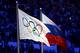 SOCHI, RUSSIA - FEBRUARY 23: The Olympic flag and Russian flag are raised as the Russian National Anthem is sung during the 2014 Sochi Winter Olympics Closing Ceremony at Fisht Olympic Stadium on February 23, 2014 in Sochi, Russia. (Photo by Paul Gilham/Getty Images)
