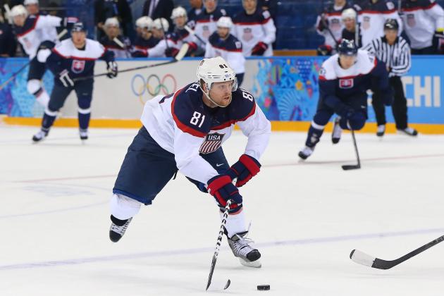 SOCHI, RUSSIA - FEBRUARY 13:  Phil Kessel #81 of United States controls the puck against Slovakia during the Men's Ice Hockey Preliminary Round Group A game on day six of the Sochi 2014 Winter Olympics at Shayba Arena on February 13, 2014 in Sochi, Russia.  (Photo by Martin Rose/Getty Images)