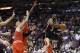 Miami Heat's Dwyane Wade (3) looks to pass as Chicago Bulls' Tony Snell, center, and Carlos Boozer (5) defend during the first half of an NBA basketball game, Sunday, Feb. 23, 2014, in Miami. (AP Photo/Lynne Sladky)