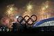 A man takes a photograph of fireworks during the closing ceremony of the 2014 Winter Olympics, Sunday, Feb. 23, 2014, in Sochi, Russia. (AP Photo/Petr David Josek)