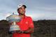 Jason Day with a well-deserved winner's trophy.