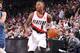 PORTLAND, OR - FEBRUARY 23: Damian Lillard #0 of the Portland Trail Blazers handles the ball during a game against the Minnesota Timberwolves on February 23, 2014 at the Moda Center Arena in Portland, Oregon. NOTE TO USER: User expressly acknowledges and agrees that, by downloading and or using this photograph, user is consenting to the terms and conditions of the Getty Images License Agreement. Mandatory Copyright Notice: Copyright 2014 NBAE (Photo by Sam Forencich/NBAE via Getty Images)