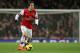 Arsenal Tomas Rosicky takes the ball forward during their English Premier League soccer match between Arsenal and Manchester United at the Emirates stadium in London, Wednesday, Feb. 12, 2014. (AP Photo/Alastair Grant)