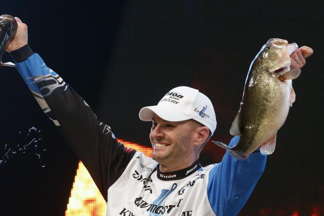 Randy Howell, Springville, Ala., holds up two bass at a weigh-in, Sunday Feb. 23, 2014 in Birmingham, Ala. that helped him win the Bassmaster Classic on Lake Guntersville. (AP Photo/Hal Yeager)