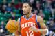 Feb 12, 2014; Salt Lake City, UT, USA; Philadelphia 76ers small forward Evan Turner (12) dribbles up the court during the first quarter against the Utah Jazz at EnergySolutions Arena. Mandatory Credit: Russ Isabella-USA TODAY Sports