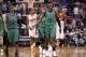 Boston Celtics' Rajon Rondo (9) and Jeff Green (8) dejectedly slap hands after the Celtics failed to score against the Phoenix Suns in the closing moments during the second half of an NBA basketball game, Wednesday, Feb. 19, 2014, in Phoenix. The Suns defeated the Celtics 100-94. (AP Photo/Ross D. Franklin)