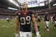 Houston Texans defensive end J.J. Watt leaves the field after an NFL football game against the St. Louis Rams Sunday, Oct. 13, 2013, in Houston, Texas. The Rams won 38-13. (AP Photo/J. Patric Schneider)