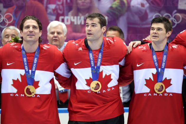 SOCHI, RUSSIA - FEBRUARY 23: Gold medalists Patrick Sharp #10, Patrick Marleau #12 and Chris Kunitz #14 of Canada celebrate during the medal ceremony after defeating Sweden 3-0 during the Men's Ice Hockey Gold Medal match on Day 16 of the 2014 Sochi Winter Olympics at Bolshoy Ice Dome on February 23, 2014 in Sochi, Russia. (Photo by Bruce Bennett/Getty Images)