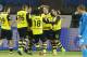 Zenit's Andrey Arshavin, right, watches as Borussia's Henrikh Mkhitaryan, center right, and other team players celebrate their goal against Zenit during the Champions League soccer match between Zenit St.Petersburg and Borussia Dortmund at Petrovsky stadium in St.Petersburg, Russia, on Tuesday, Feb. 25, 2014. (AP Photo/Dmitry Lovetsky)