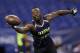 Oregon running back De'Anthony Thomas runs a drill at the NFL football scouting combine in Indianapolis, Sunday, Feb. 23, 2014. (AP Photo/Michael Conroy)