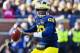 Michigan quarterback Devin Gardner (98) throws a pass in the first quarter of an NCAA college football game with Ohio State in Ann Arbor, Mich., Saturday, Nov. 30, 2013. (AP Photo/Tony Ding)