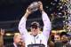 INDIANAPOLIS, IN - DECEMBER 07: Mark Dantonio the head coach of the Michigan State Spartans holds the champions trophy after Michigan State beat Ohio State Buckeyes 34-24 in the Big Ten Championship at Lucas Oil Stadium on December 7, 2013 in Indianapolis, Indiana. (Photo by Andy Lyons/Getty Images)