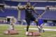 Texas defensive lineman Jackson Jeffcoat runs a drill at the NFL football scouting combine in Indianapolis, Monday, Feb. 24, 2014. (AP Photo/Michael Conroy)