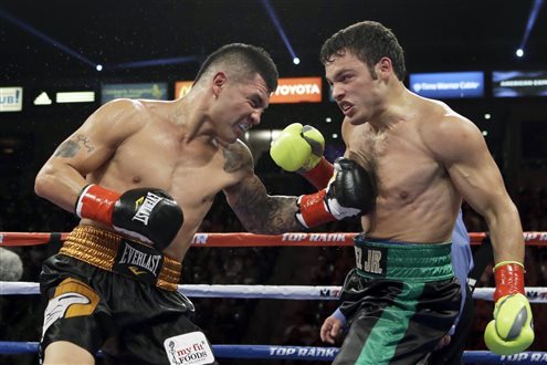 CORRECTS SPELLING OF FIRST NAME TO BRYAN - Bryan Vera lands a left to Julio Cesar Chavez Jr. in the fourth round of a 10-round boxing match between Chavez, the former World Boxing Council (WBC) middleweight champion, and Vera, the contender, in Carson, Calif., Saturday, Sept. 28, 2013. Chavez won in a unanimous decision. (AP Photo/Reed Saxon)