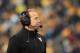 West Virginia coach Dana Holgorsen looks on from the sideline during the third quarter of their NCAA college football game against Iowa State in Morgantown, W.Va., on Saturday, Nov. 30, 2013. Iowa State won 52-44 in triple- overtime. (AP Photo/Christopher Jackson)