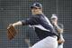 New York Yankees starting pitcher Masahiro Tanaka throws a pitch during spring training baseball practice Friday, Feb. 21, 2014, in Tampa, Fla. (AP Photo/Charlie Neibergall)
