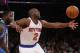 In this Monday, Feb. 24, 2014, photo, New York Knicks' Raymond Felton (2) loses the ball as he drives against Dallas Mavericks' DeJuan Blair during the first half of an NBA basketball game in New York. Felton was arrested Tuesday on weapons charges after a lawyer for Felton's wife turned in a loaded gun allegedly belonging to the basketball star, saying she didn't want it in her home, police said. Felton turned himself in at 12:50 a.m. Tuesday, not long after the Knicks lost to the Mavericks. (AP Photo/Jason DeCrow)