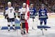 VANCOUVER, BC - FEBRUARY 26: Olympic gold medallists Alex Pietrangelo #27 and Jay Bouwmeester #19 of the St. Louis Blues, and Roberto Luongo #1and Dan Hamhuis #2 of the Vancouver Canucks are honoured before their NHL game at Rogers Arena February 26, 2014 in Vancouver, British Columbia, Canada. Vancouver won 1-0. (Photo by Jeff Vinnick/NHLI via Getty Images)